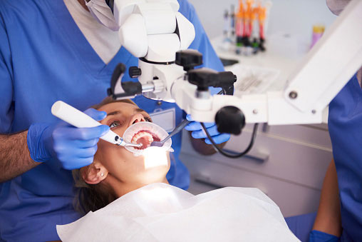 A woman undergoing a root canal procedure