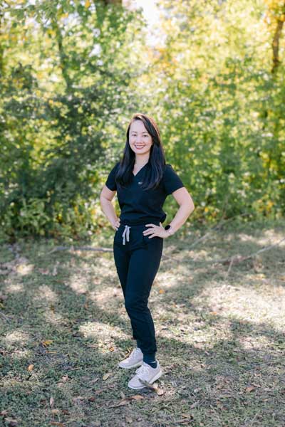 Dr. Jean Larsen at Parkside Dental wearing black scrubs