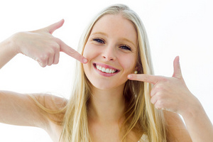 A young lady showing off her freshly whitened smile