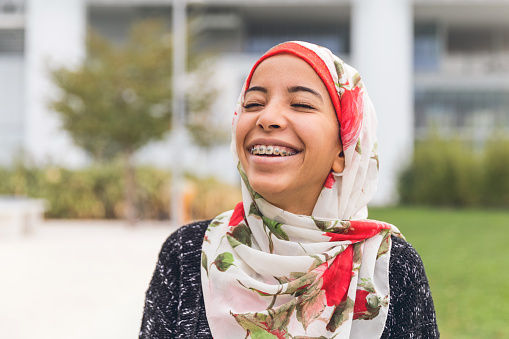 young orthodontics patient smiling with eyes closed